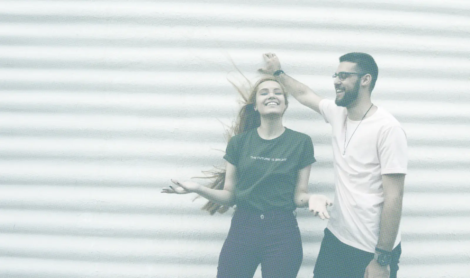 Friends Standing Against White Wall