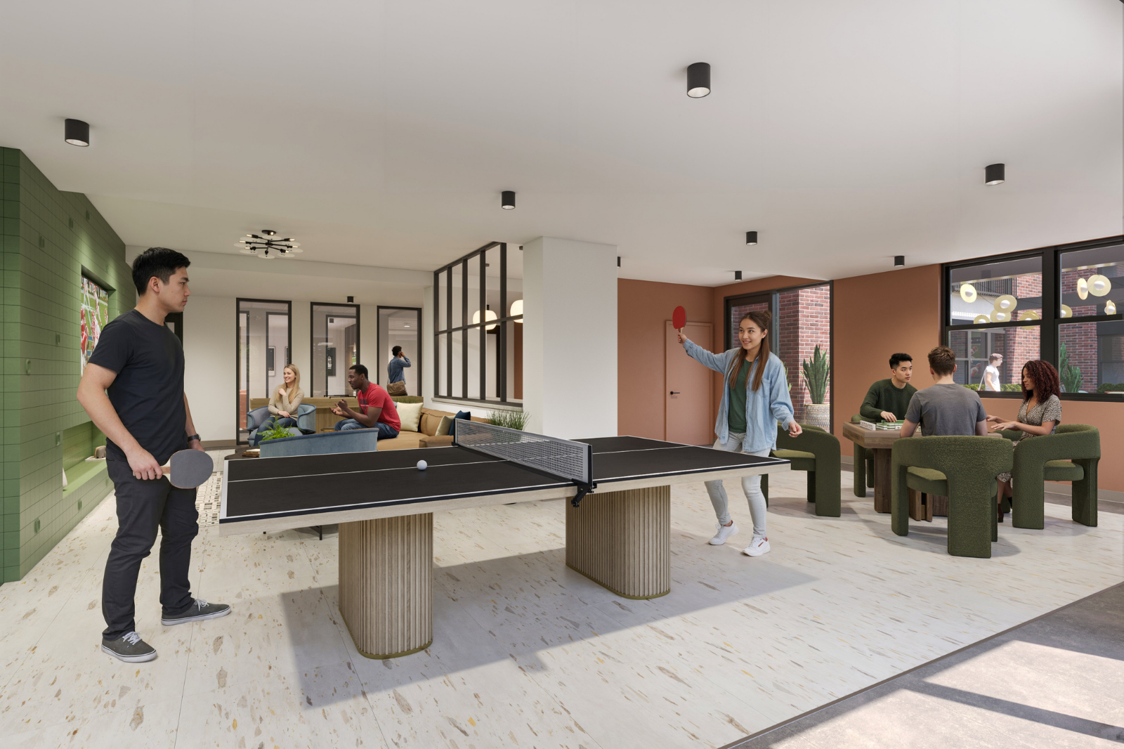 Resident clubroom with ping pong table, lounge seating, game tables, and collaborative spaces designed for recreation and socializing.
