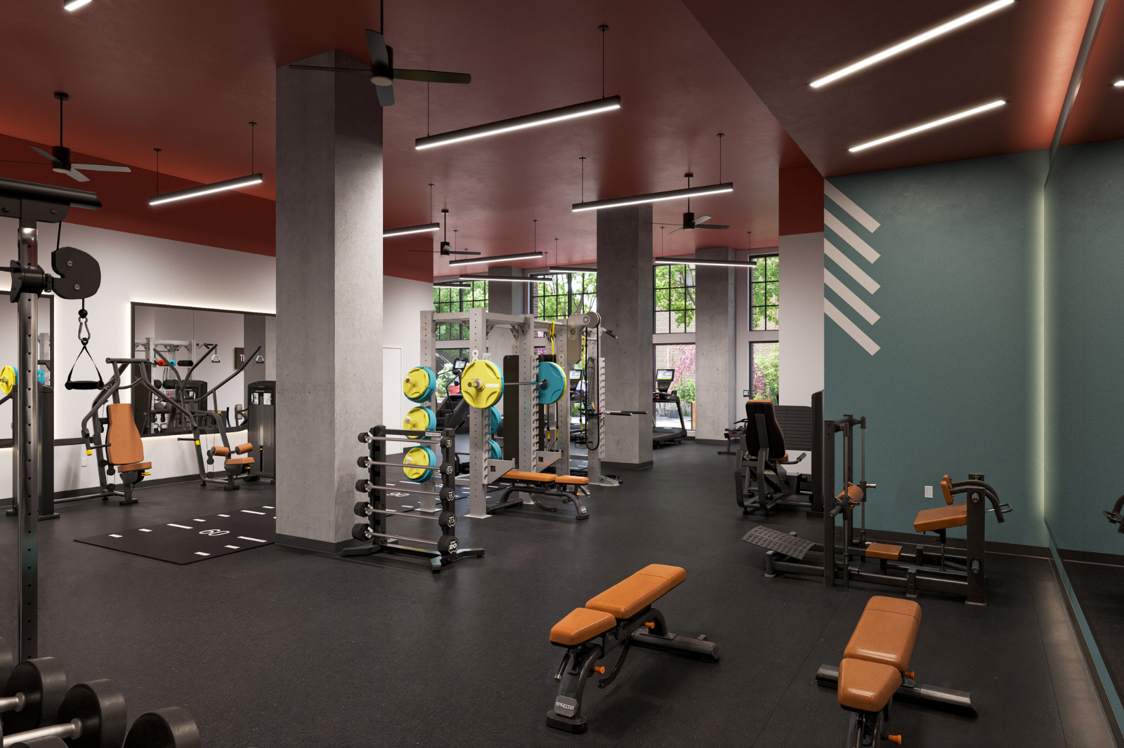 Fully equipped fitness center featuring strength-training machines, free weights, benches, and cardio equipment in a spacious workout environment.